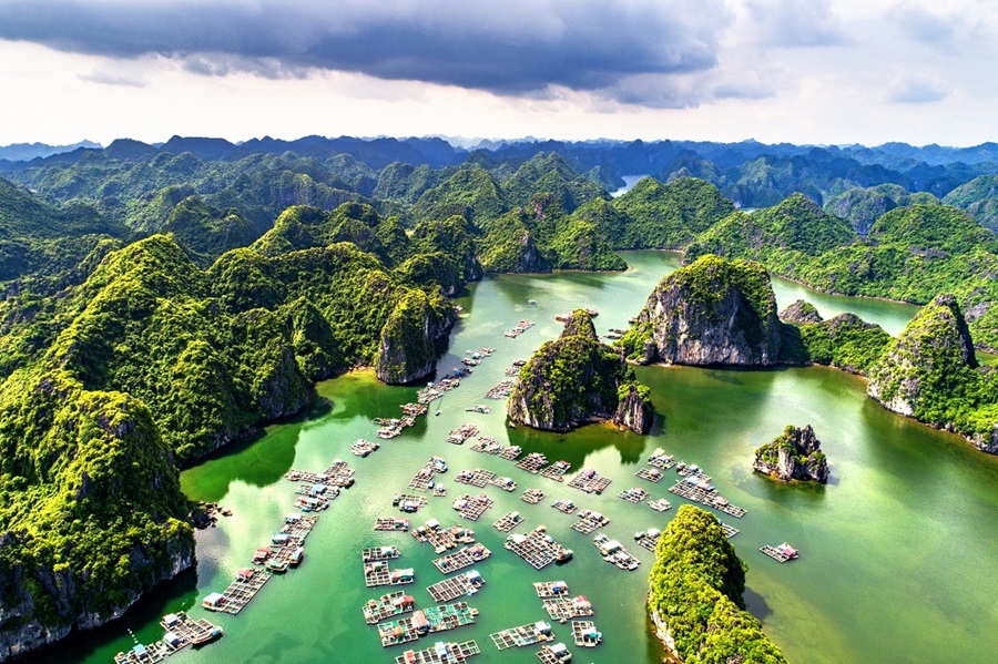 A junk anchored between limestone islands